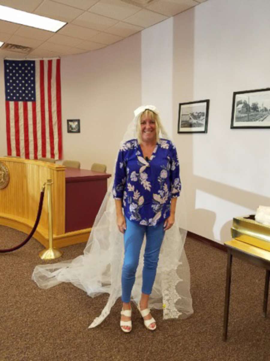 PHOTO: Kim Peck trying on her mother's vintage wedding veil. 