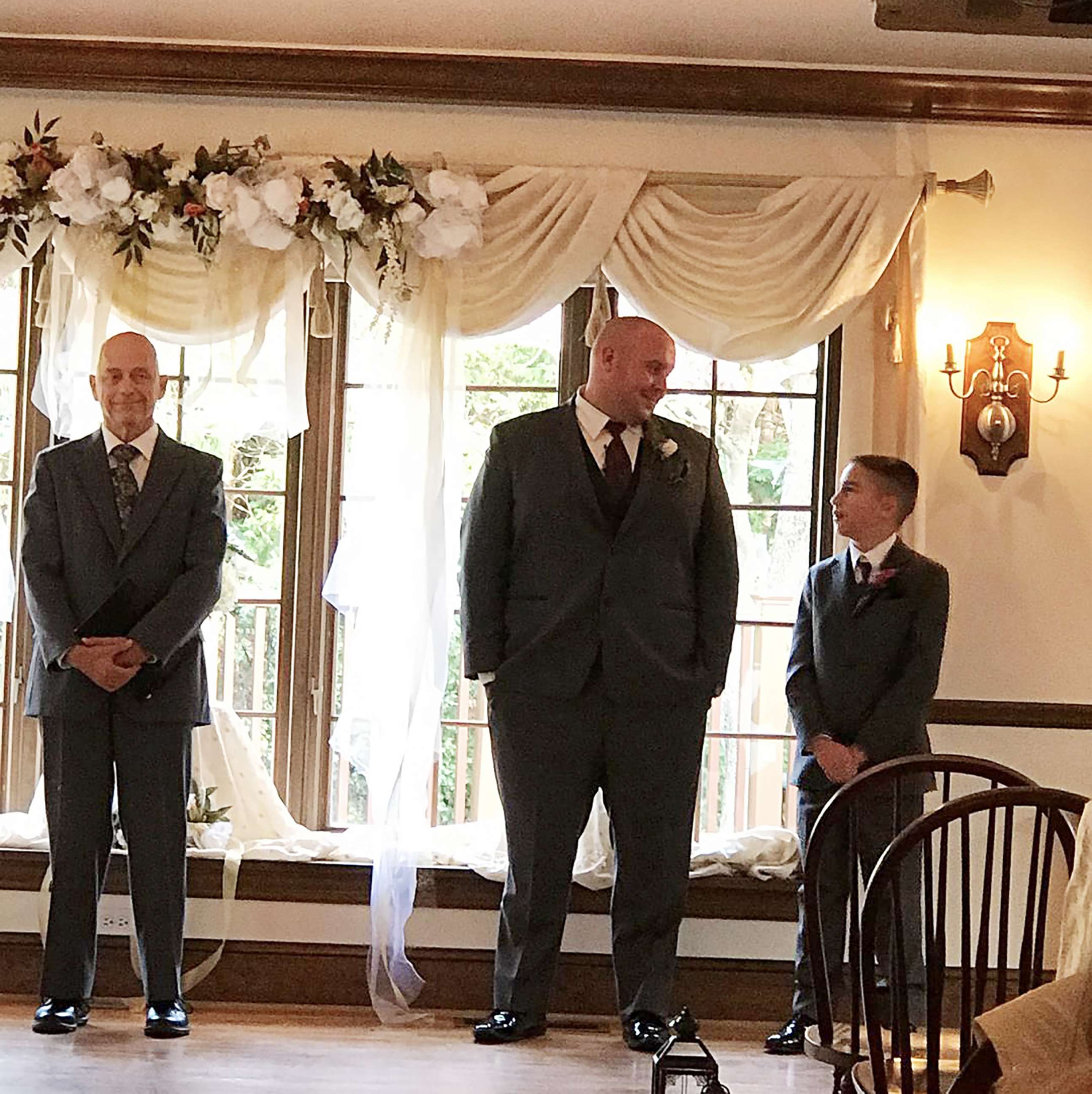 PHOTO: Kevin and Jaydon Rabatin stand at the altar anxiously awaiting the bride.
