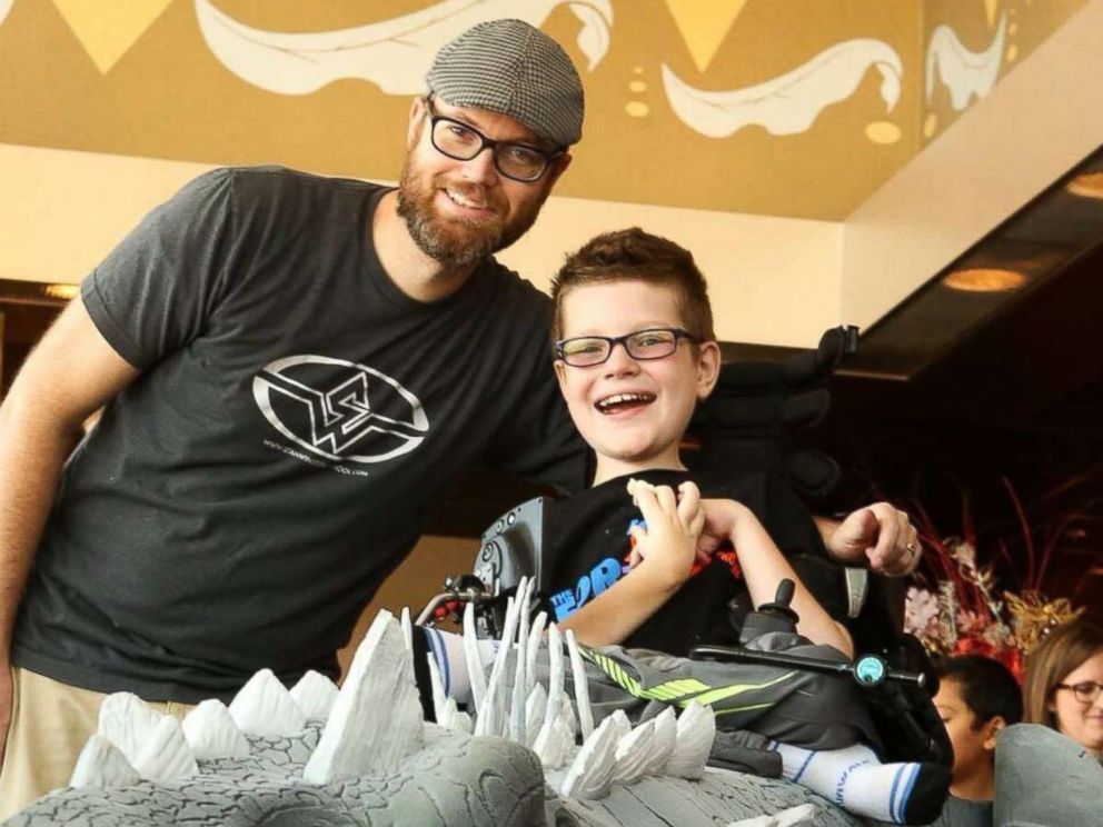 PHOTO: Magic Wheelchair founder Ryan Weimer poses with his eldest son, Keaton.