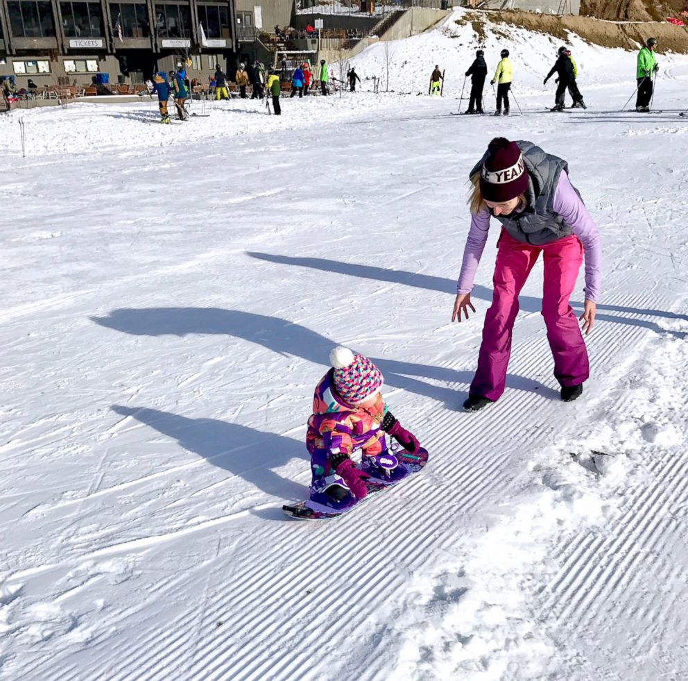 PHOTO: Whitney Rowley teaching her 1-year-old daughter Cash how to snowboard.