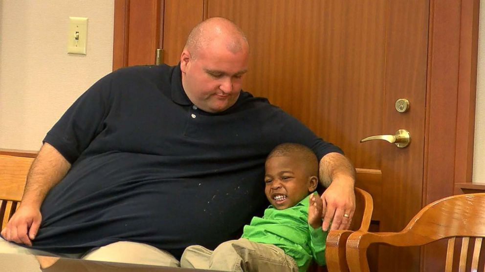 PHOTO: Will Rom and his son KJ Rom sit in Judge Ralph Winkler's courtroom at Hamilton County Probate Court in Cincinnati, July 27, 20017, awaiting the adoption proceeding to begin. 
