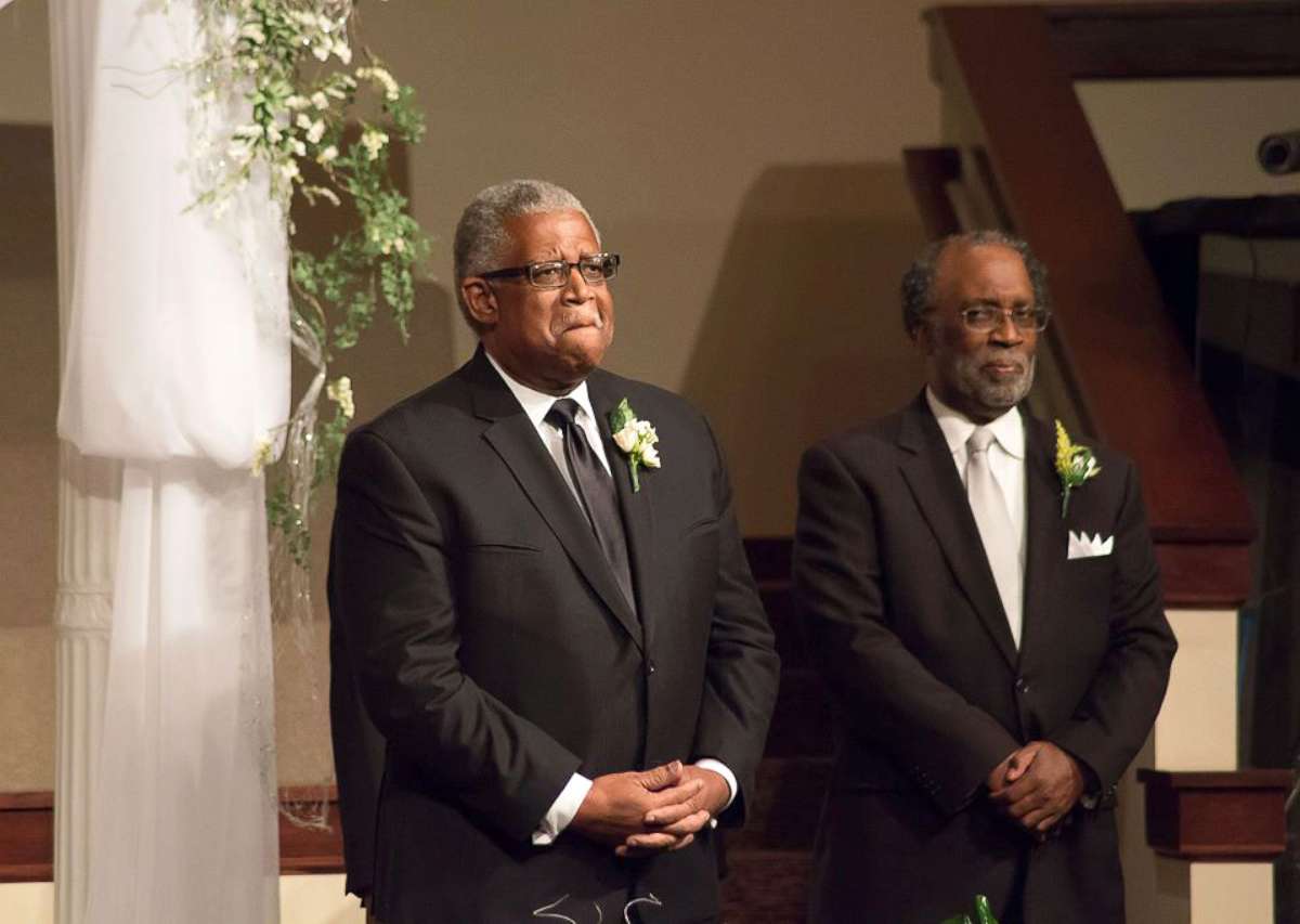 PHOTO: Groom Murphy Wilson, 70, looks on as his bride Lucinda Myers, 67, walks down the aisle at First Seventh-day Adventist Church in Huntsville, Alabama on July 29.