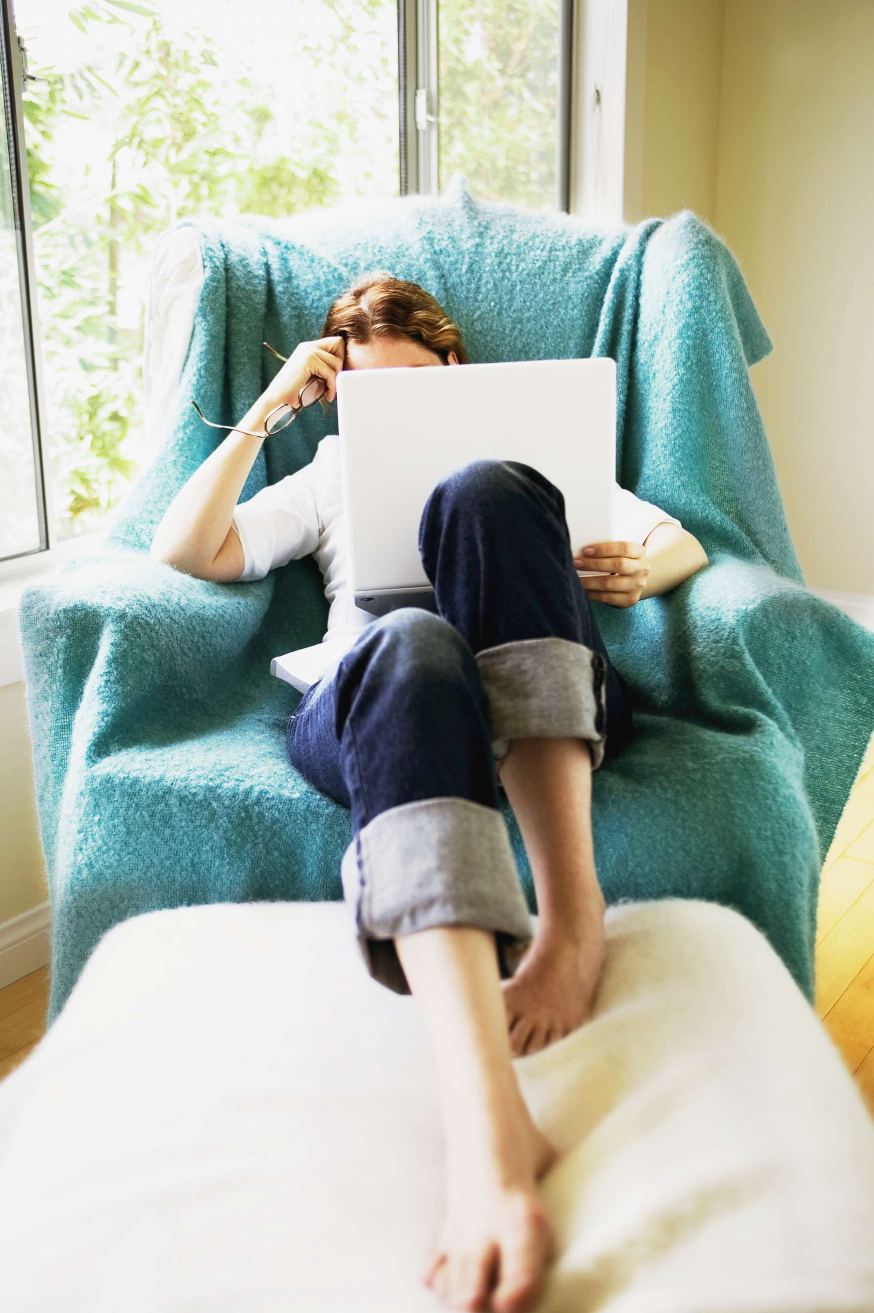 PHOTO: A woman looks at her laptop computer in this undated stock photo.