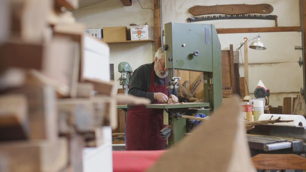 PHOTO: Woodworker Norm Sartorius carves an abstract wooden spoon in his backyard studio in Parkersburg, West Virginia.