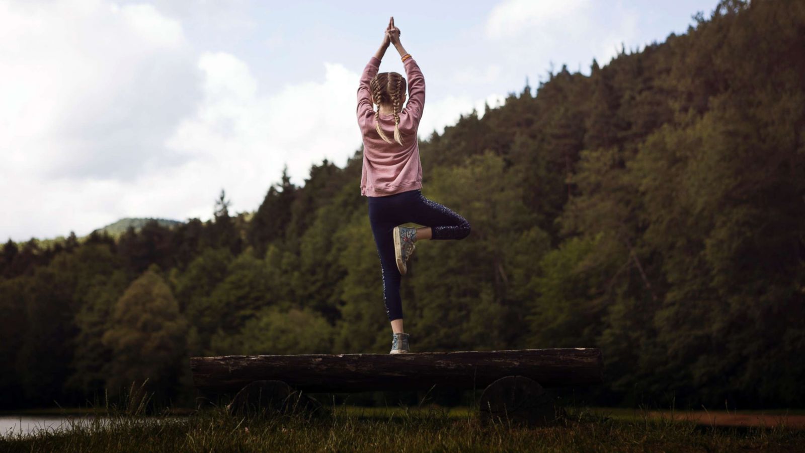 PHOTO: A child practices the tree yoga pose in this undated stock photo.