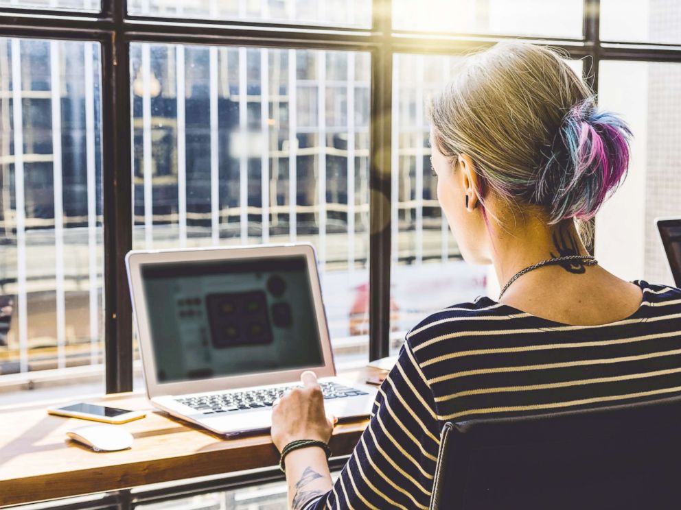 PHOTO: In this undated stock photo, a young woman uses the internet.