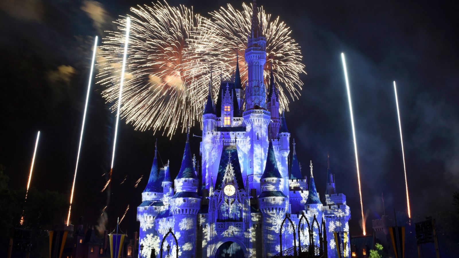 PHOTO: Fireworks illuminate the sky above Cinderella Caster during "Holiday Wishes: Celebrate the Spirit of the Season."