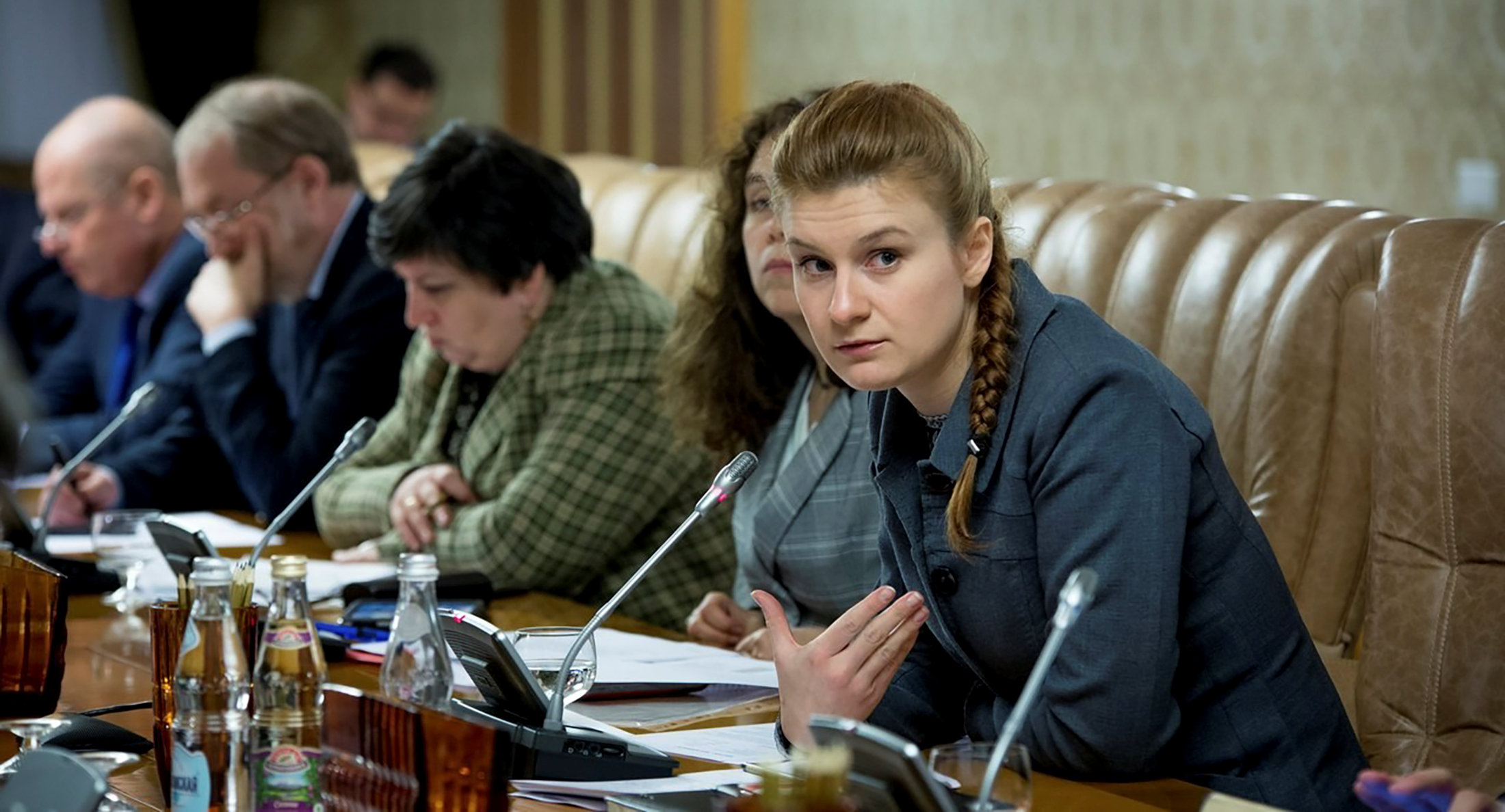 PHOTO: Maria Butina, right, attends a meeting of a group of experts, affiliated to the Russian government, in this undated handout photo obtained by Reuters on July 17, 2018. 