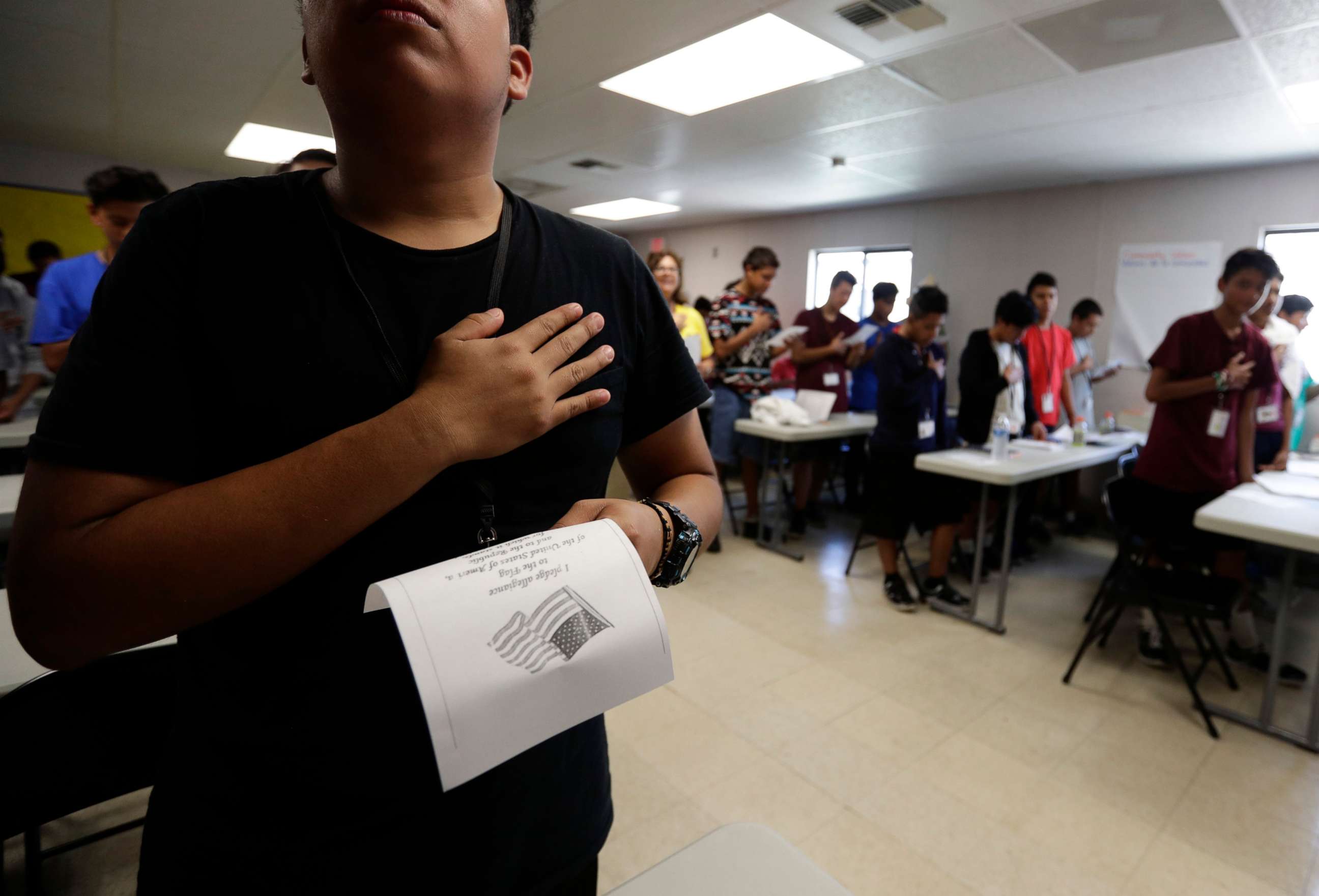 PHOTO: Immigrants say the Pledge of Allegiance in a writing class at the U.S. government's holding center for migrant children in Carrizo Springs, Texas, July 9, 2019.