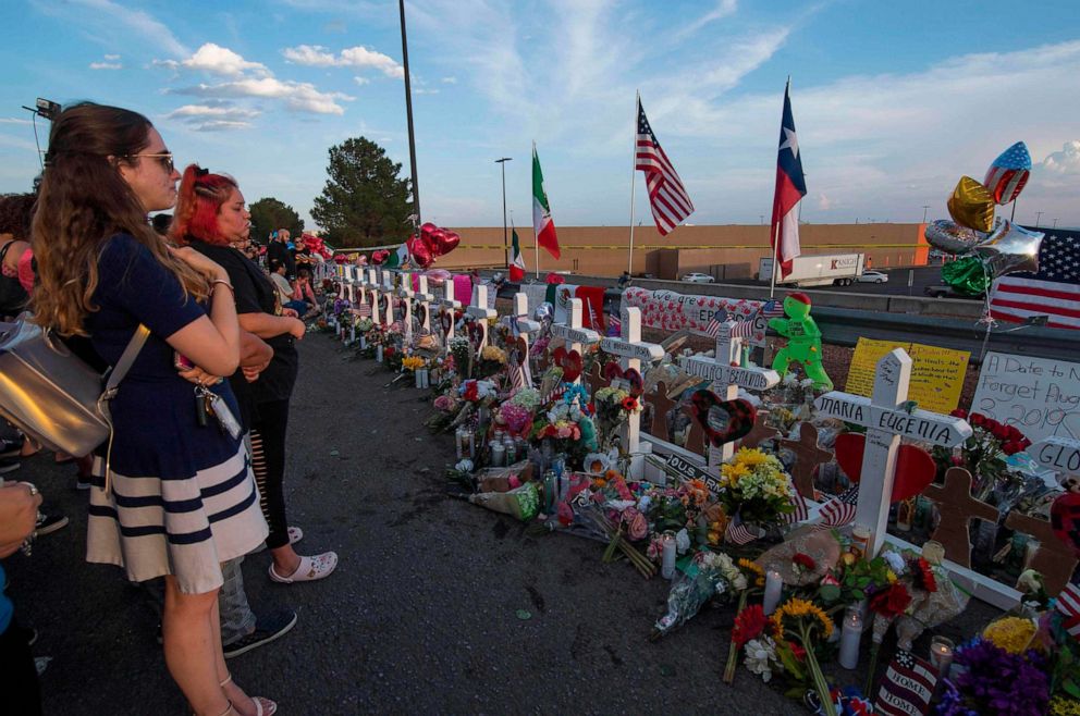 PHOTO: People pay their respects at a makeshift memorial for victims of Walmart shooting at the Cielo Vista Mall WalMart in El Paso, Texas, on Aug. 5, 2019.