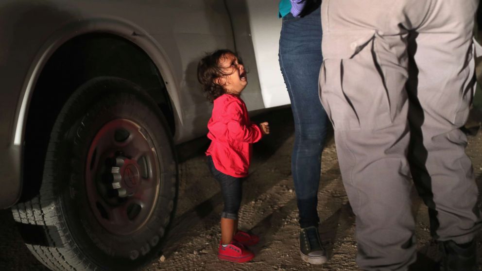 A two-year-old Honduran asylum seeker cries as her mother is searched and detained near the U.S.-Mexico border on June 12, 2018, in McAllen, Texas. The asylum seekers had rafted across the Rio Grande from Mexico and were detained by U.S. Border Patrol agents before being sent to a processing center for possible separation. Customs and Border Protection (CBP) is executing the Trump administration's "zero tolerance" policy towards undocumented immigrants.