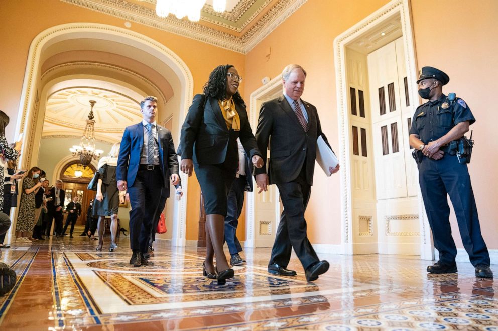 PHOTO: Supreme Court nominee Ketanji Brown Jackson walks with former Senator Doug Jones of Alabama to a meeting with Senate Minority Leader Mitch McConnell of Ky., on Capitol Hill, March 2, 2022, in Washington, D.C. 