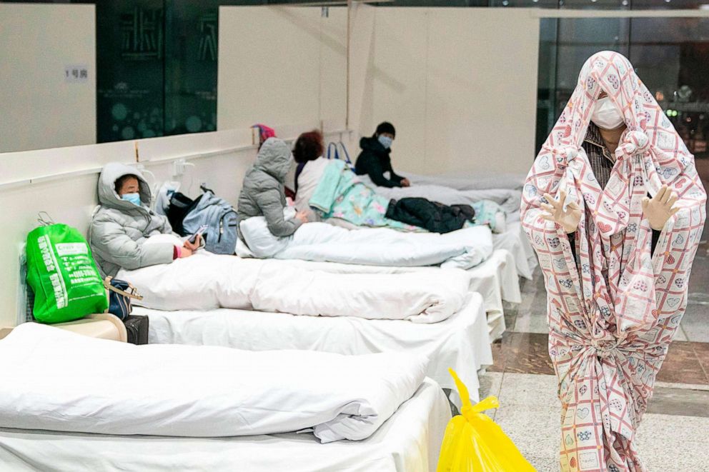 PHOTO: This photo taken on Feb. 5, 2020, shows a patients at an exhibition center that's been converted into a hospital as it starts accepting people displaying mild symptoms of the novel coronavirus in Wuhan in China's central Hubei province.