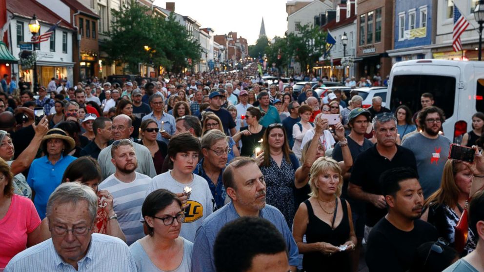 PHOTO: Mourners walk during a vigil in response to a shooting at The Capital Gazette newspaper office, June 29, 2018, in Annapolis, Md.