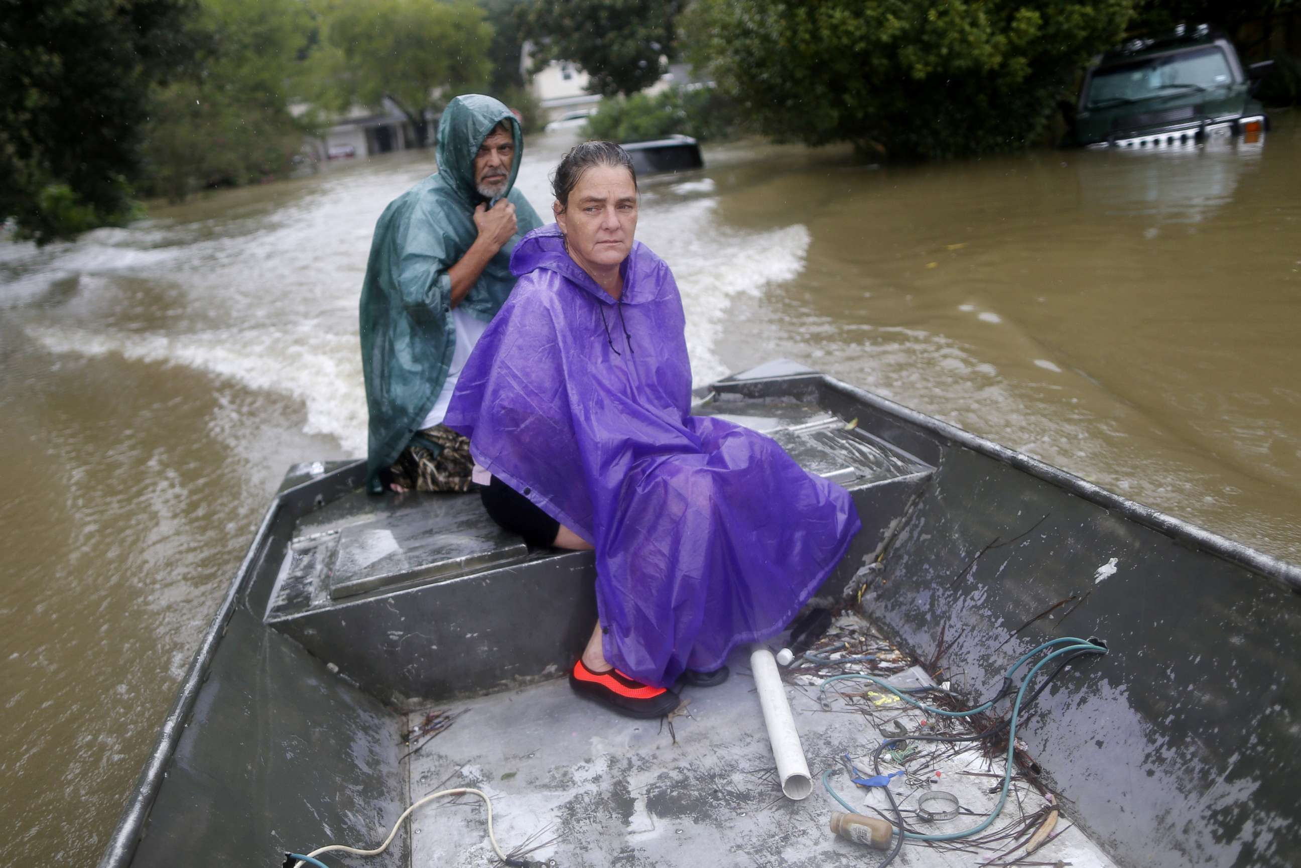 PHOTO: Curtis and Michelle Bertrand look for residents to rescue from the flood waters of Tropical Storm Harvey in Beaumont Place, Texas, on Aug. 28, 2017.