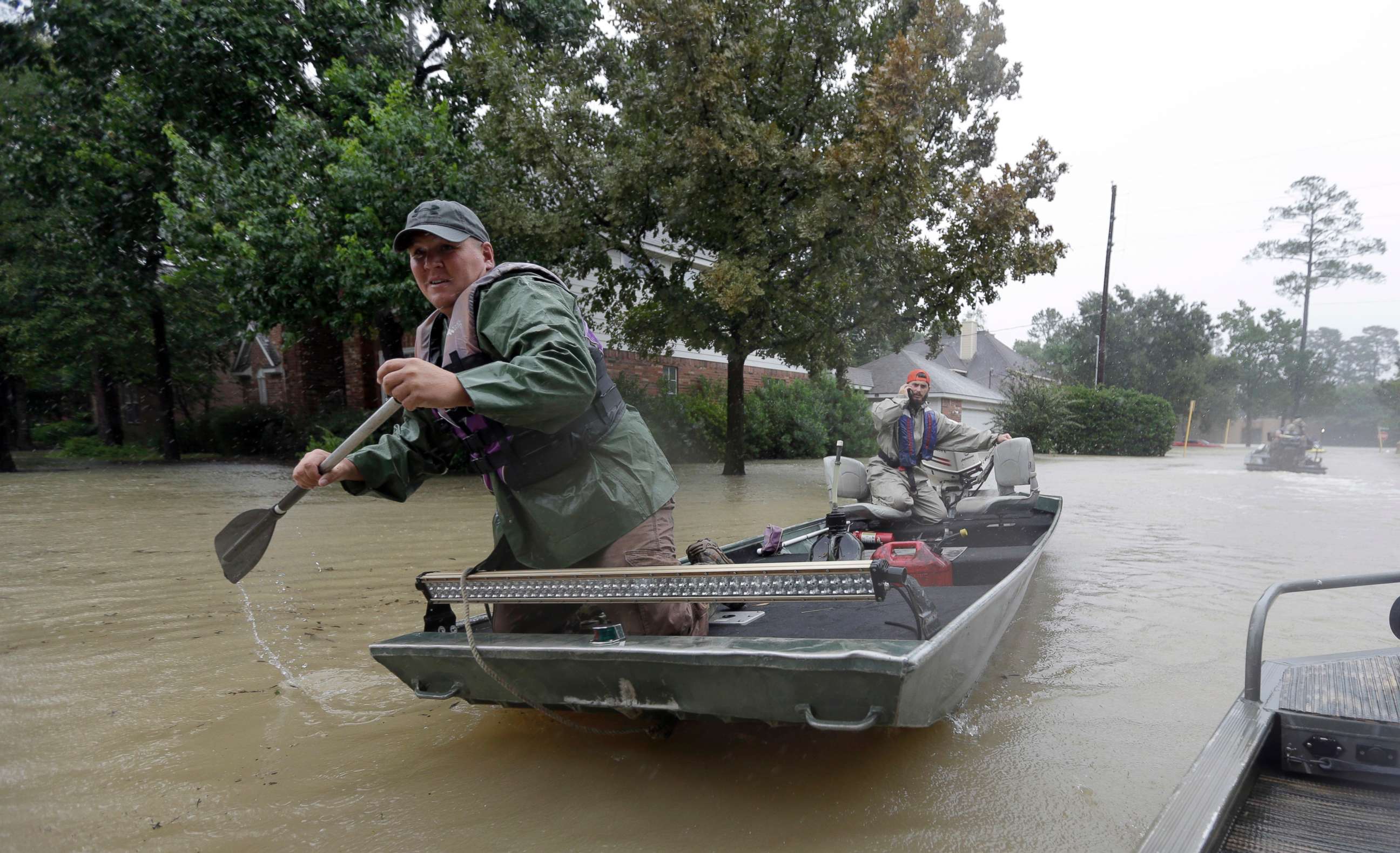 PHOTO: Volunteers use their boat to help evacuate residents as floodwaters from Tropical Storm Harvey rise Monday, Aug. 28, 2017, in Spring, Texas.