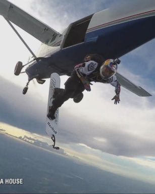 Red Bull Extreme Flyer Skysurfs Through Clouds in Lightning Storm