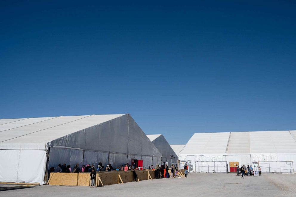 PHOTO: In this Nov. 4, 2021, file photo, Afghan refugees wait in line to enter a supply tent in an Afghan refugee camp in Holloman Air Force Base, New Mexico.