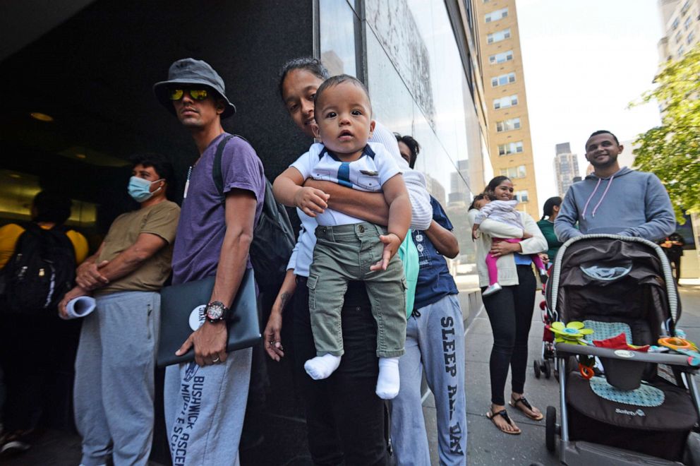 PHOTO: One year old Venezuelan migrant Dixon waits with his mother Maria outside of the New York Catholic Center, hoping to get some assistance, on Aug. 16, 2022, in New York.