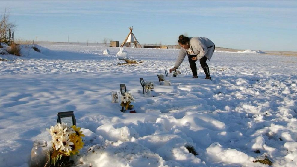 PHOTO: Shylee Brave visits the graves of the six children from the Rosebud Sioux tribe after their remains were brought back to the reservation in South Dakota from the Carlisle Indian School in Carlisle, Penn.
