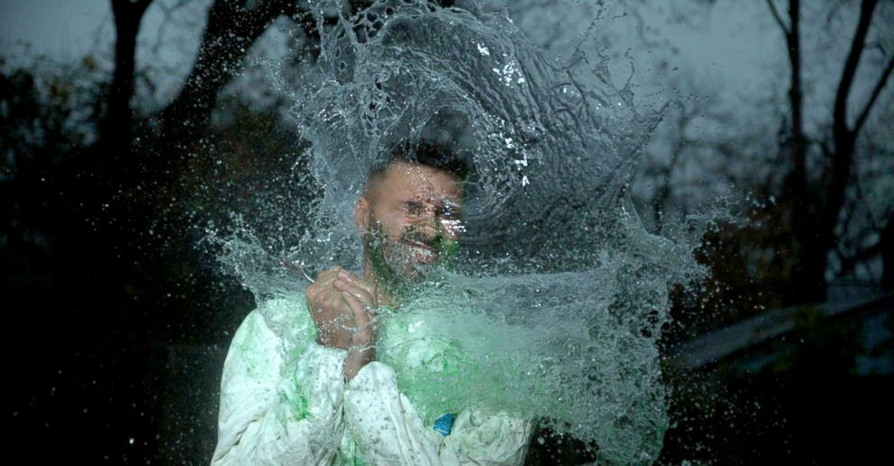 PHOTO: ABC News' Ashan Singh gets hit in the face with The Slow Mo Guys water balloon on assignment for Nightline.