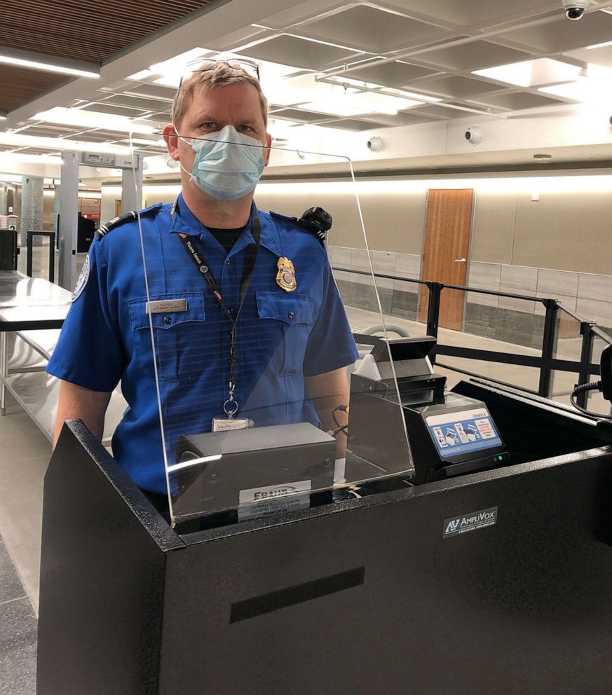PHOTO: At around dozen airports in the U.S. TSA has installed plexiglass at the travel document checking podium amid the COVID-19 pandemic.