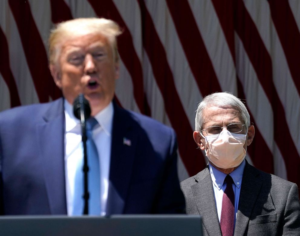 PHOTO: U.S. President Donald Trump is flanked by Dr. Anthony Fauci, director of the National Institute of Allergy and Infectious Diseases, while speaking about coronavirus vaccine development at the White House in Washington, D.C., on May 15, 2020.