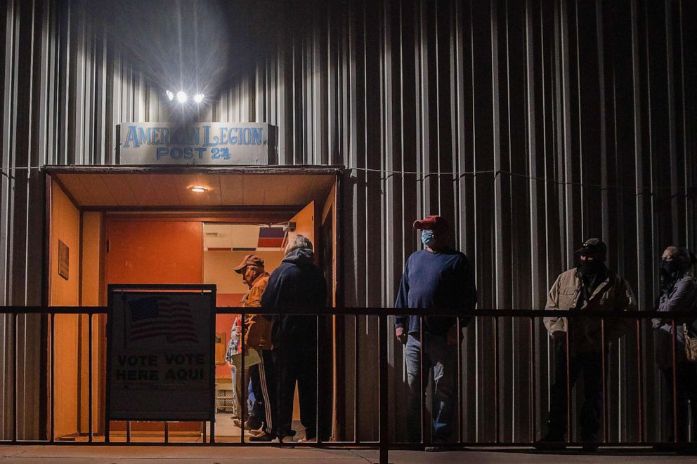 PHOTO: People wait in line to vote in the early morning in front of the American Legion in Tombstone, Ariz., Nov. 3, 2020.
