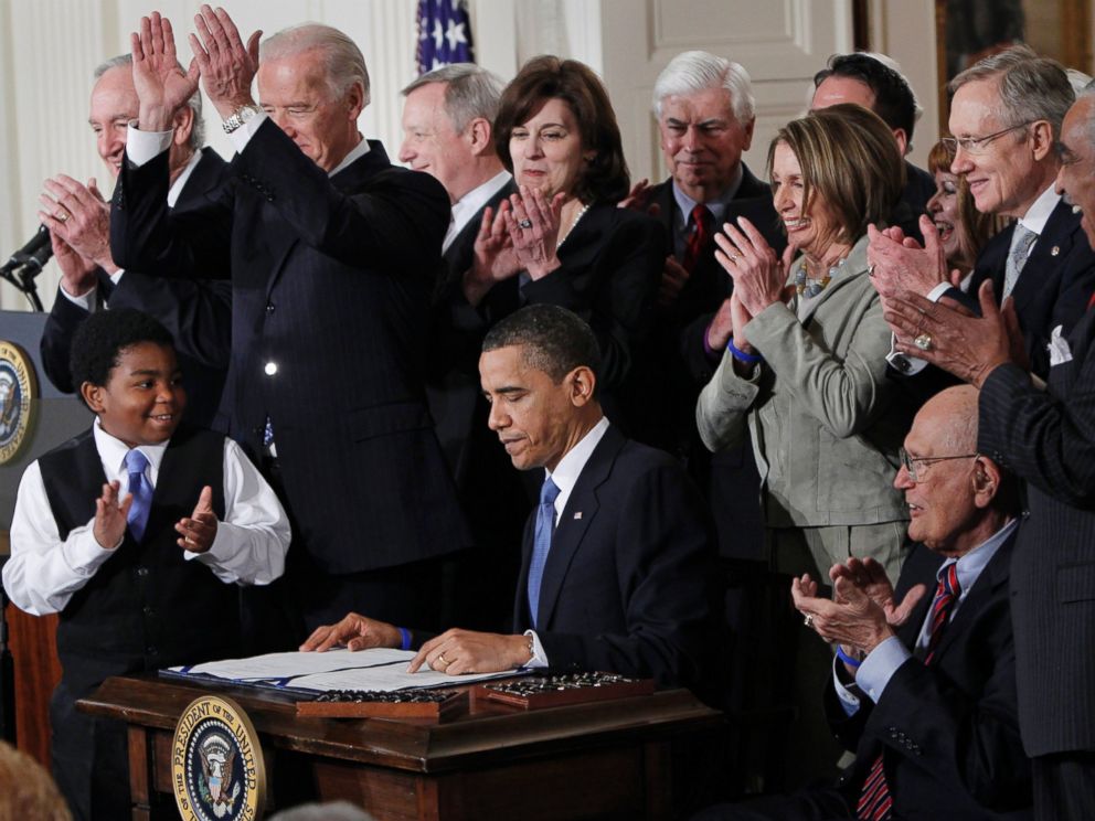 PHOTO: President Barack Obama is applauded after signing the Affordable Care Act into law in the East Room of the White House on March 23, 2010.