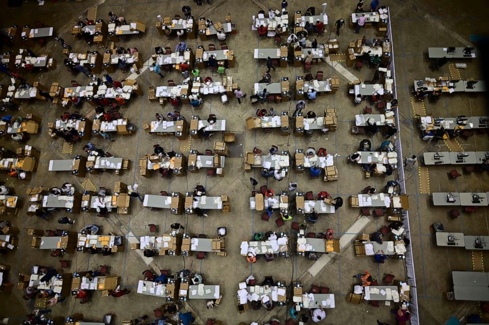 PHOTO: Officials count early votes at the Roberto Clemente Coliseum during general elections in San Juan, Puerto Rico, Nov. 3, 2020. In addition to electing a governor, Puerto Ricans are voting in a nonbinding referendum on statehood.