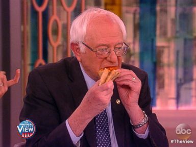 VIDEO: The presidential candidate shows his New York roots by using his hands to eat pizza.