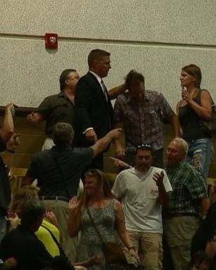 Protesters gets escorted out of the Donald Trump rally in North Carolina.