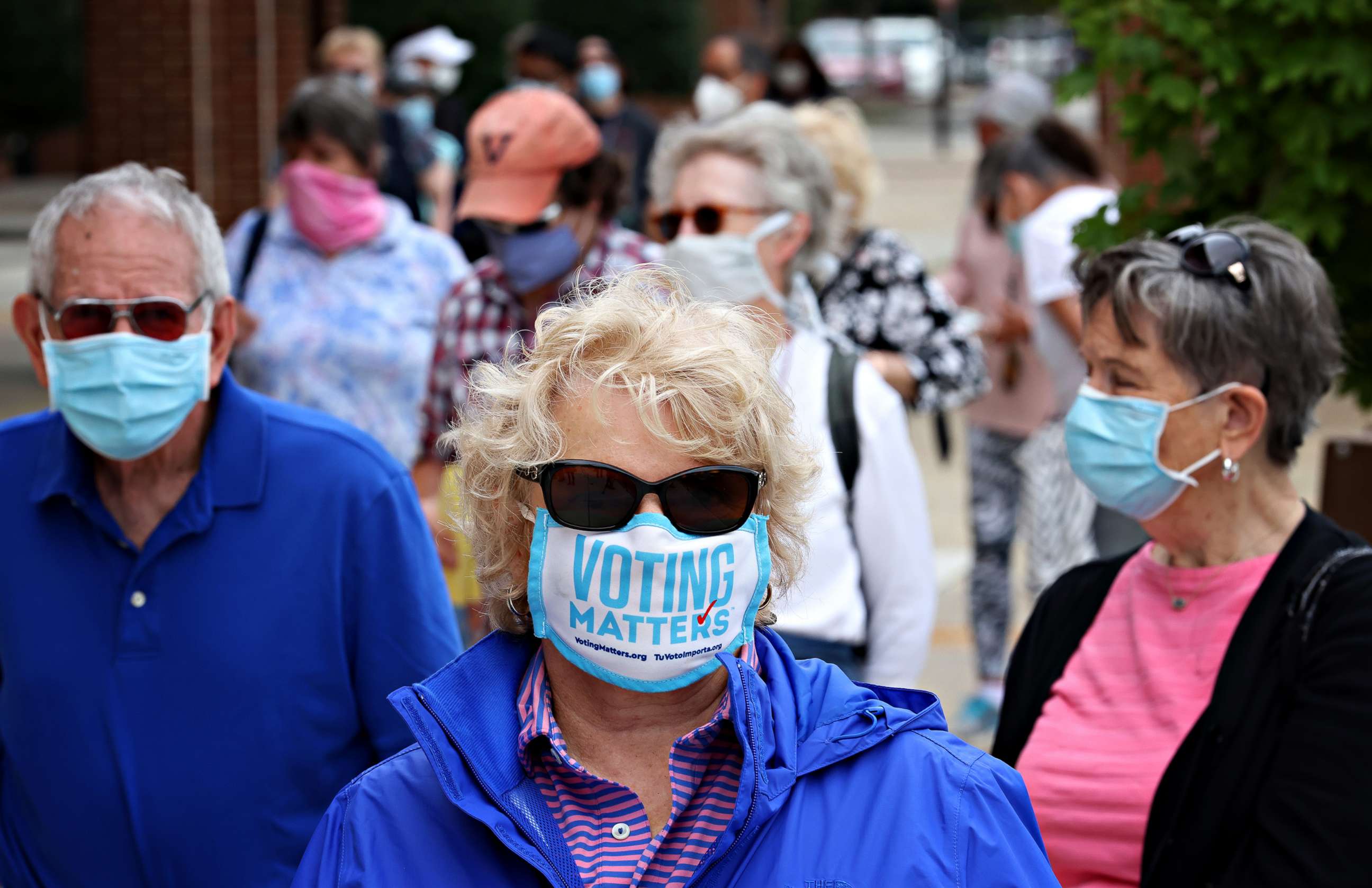 PHOTO: Voters in Virginia's 7th district wait in line to vote at the Henrico County Registrar's office on the first day of early voting, Sept. 18, 2020, in Henrico, Va.