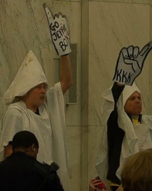 VIDEO: The group, who were costumed in KKK robes, were escorted out of the confirmation hearing for Sen. Jeff Sessions.