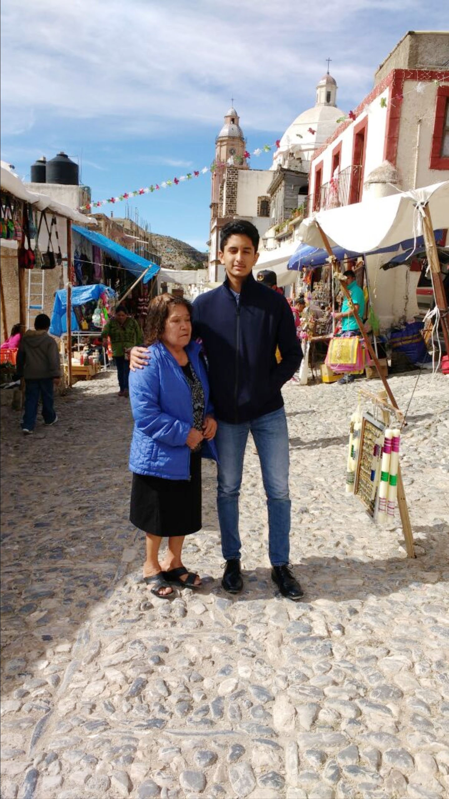 PHOTO: Eliott Flores stands with his grandmother in San Luis Potosi on his first trip back to Mexico since he moved to Texas 15 years ago.