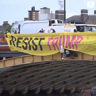 Some of the banners read, "Resist Trump," "Resist Racism" and "Resist Hate."