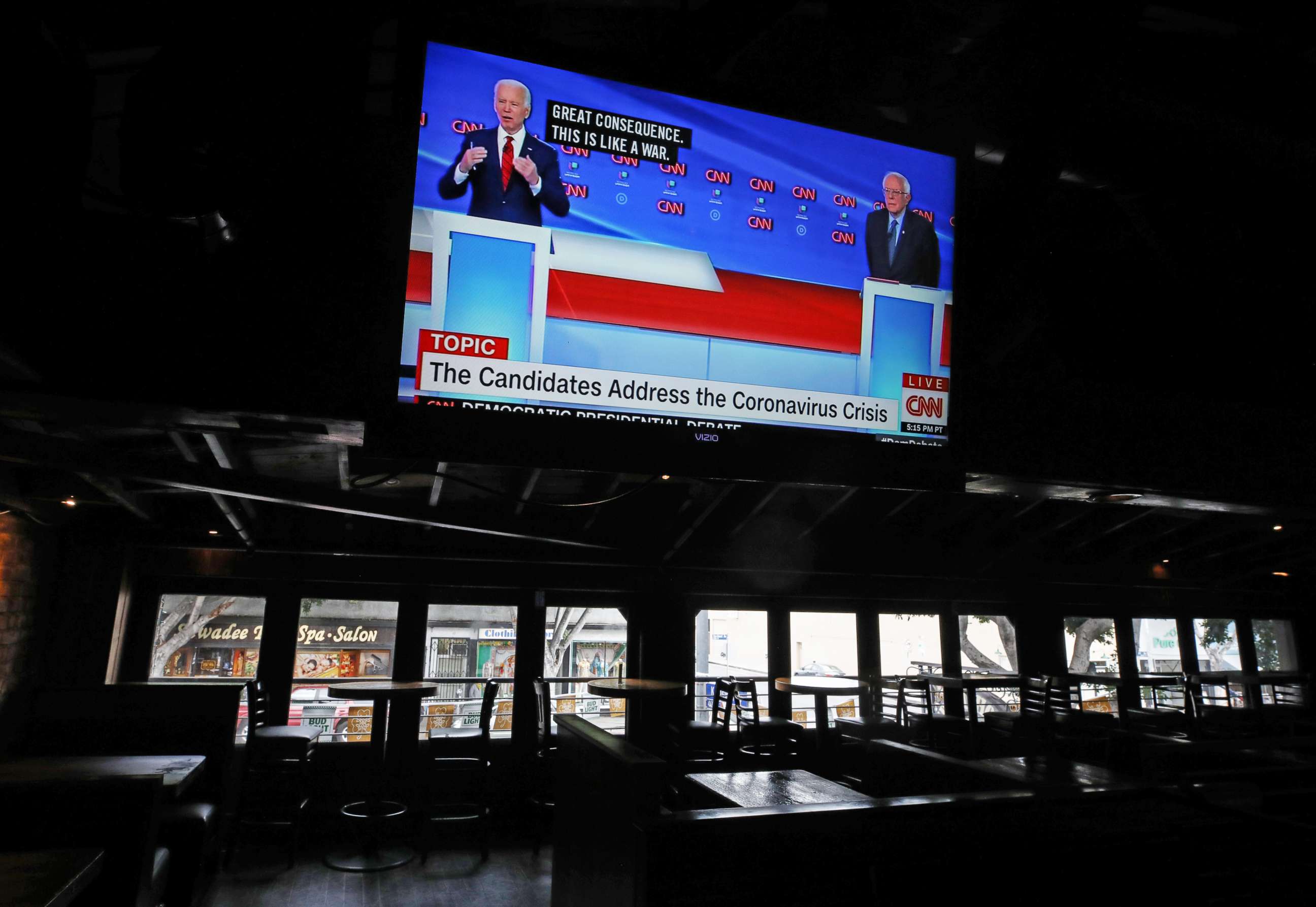 PHOTO: Democratic presidential candidate former Vice President Joe Biden (L) and Democratic presidential candidate Sen. Bernie Sanders (I-VT) speak about the coronavirus crisis on a live broadcast during the 11th Democratic Party 2020 presidential debate.