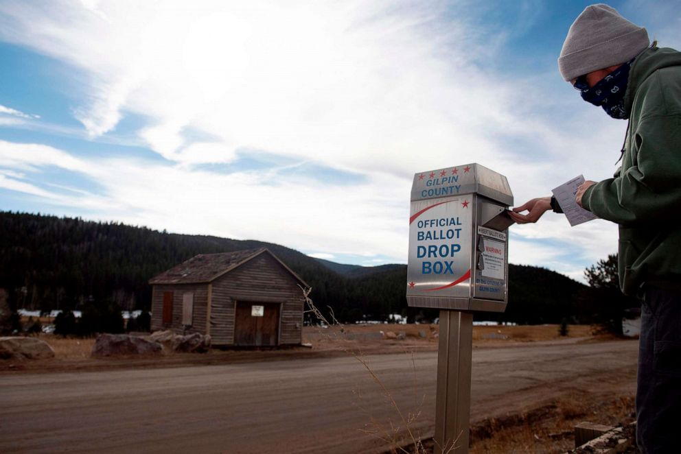 PHOTO: John Briggs of Black Hawk, Colo., drops off his ballot for the presidential election on Nov. 3, 2020, in Rollinsville, Colo.