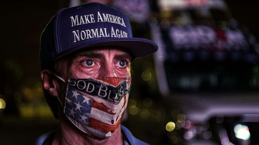  A supporter of the Democratic party attends a watch party in Miami, Nov. 3, 2020.