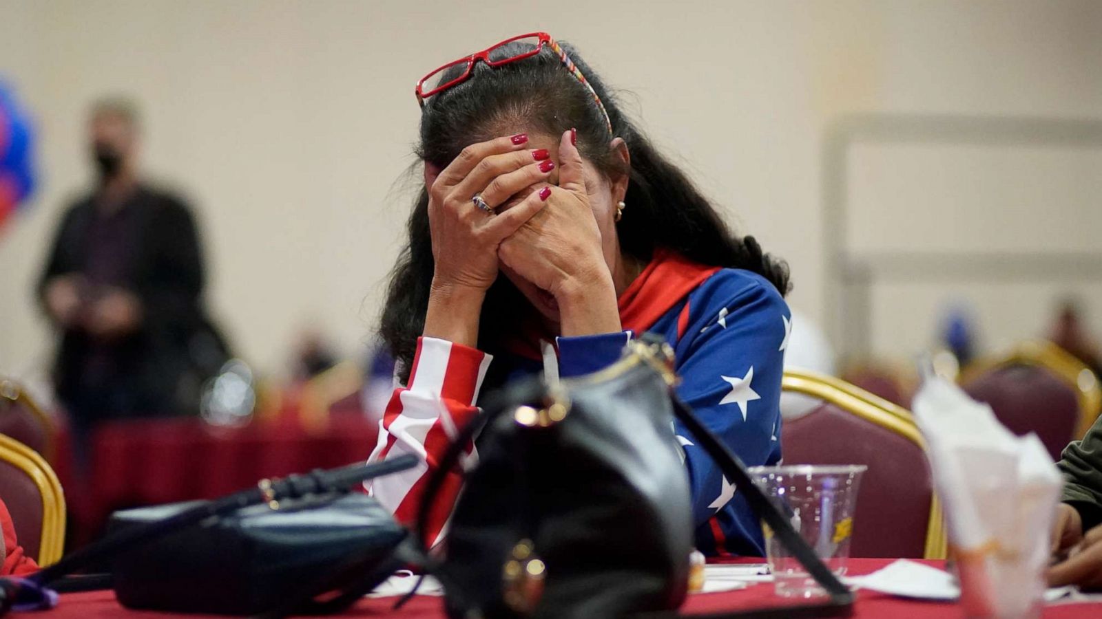 PHOTO: President Donald Trump supporter Loretta Oakes reacts while watching returns in favor of Democratic presidential candidate former Vice President Joe Biden, at a Republican election-night watch party, Nov. 3, 2020, in Las Vegas.