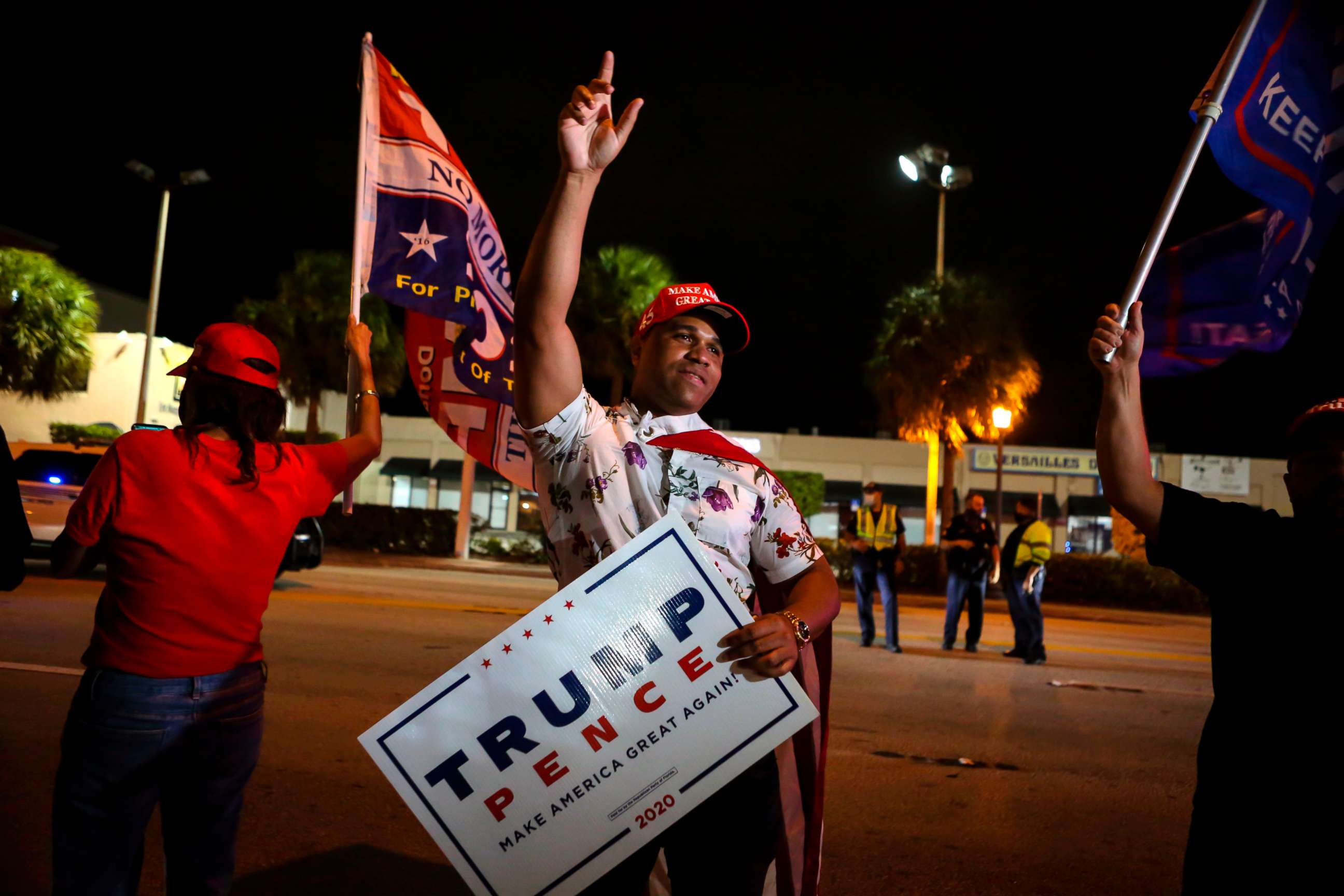 PHOTO: Supporters of President Donald Trump rally in front of Cuban restaurant Versailles in Miami, early Nov. 4, 2020.