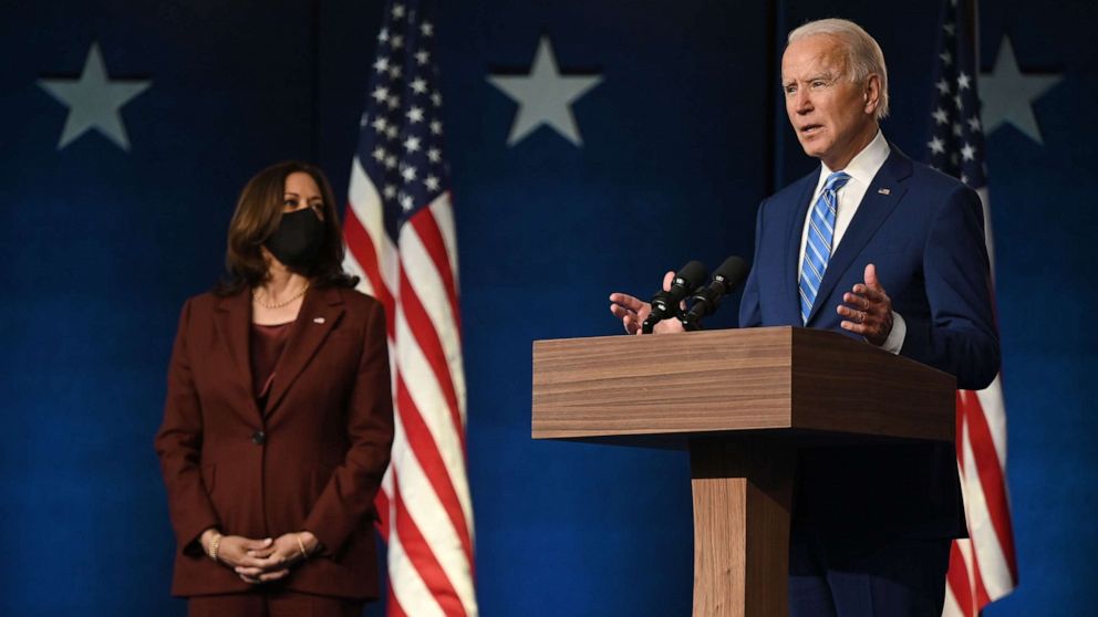 PHOTO: Democratic Presidential candidate Joe Biden speaks as Sen. and Vice-Presidential candidate, Kamala Harris, looks on at the Chase Center in Wilmington, Del., Nov. 4, 2020.