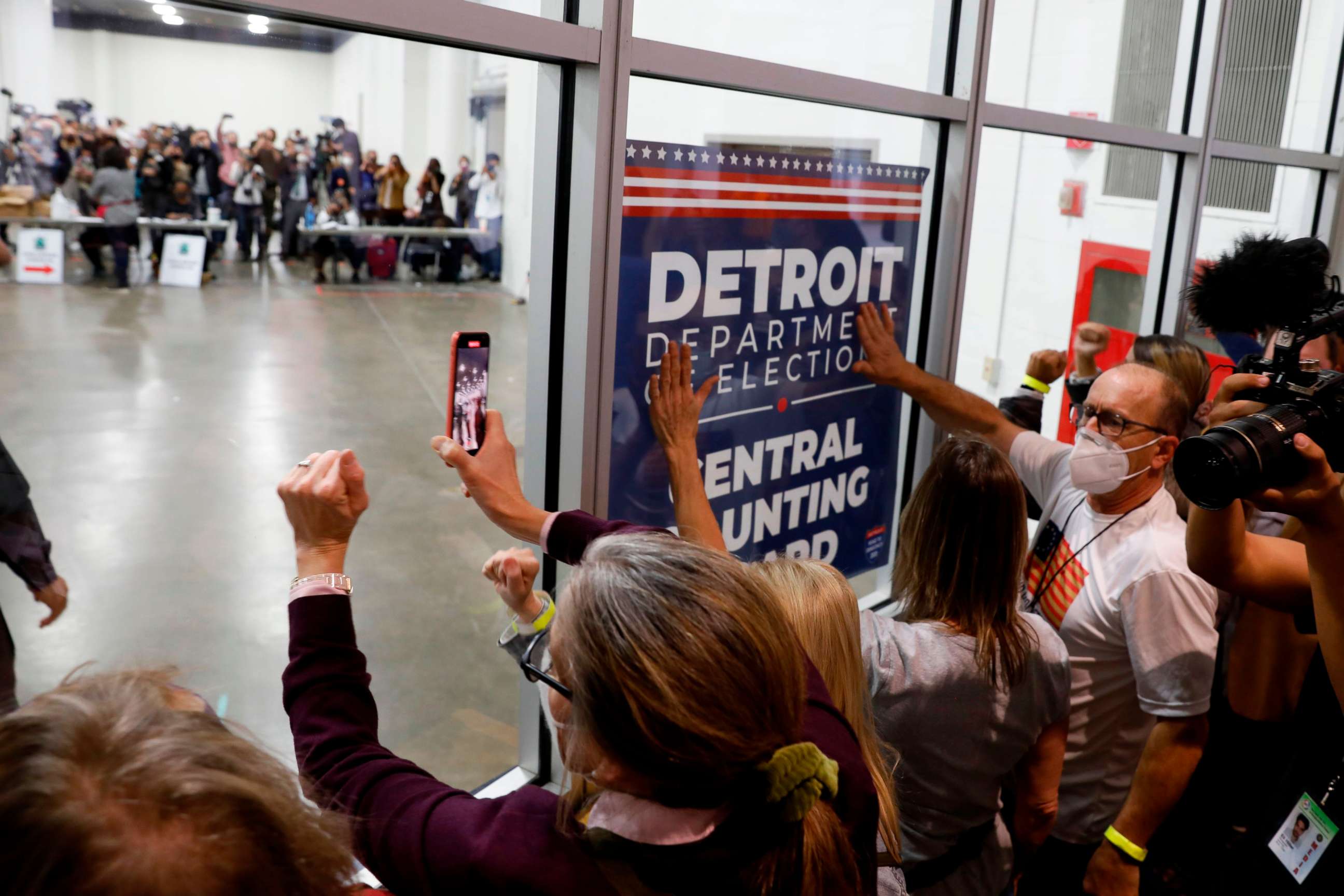 PHOTO: Supporters of President Donald Trump bang on the glass and chant slogans outside the room where absentee ballots for the 2020 general election are being counted at TCF Center on Nov. 4, 2020, in Detroit.