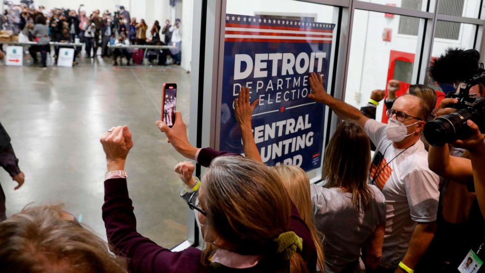 PHOTO: Supporters of President Donald Trump bang on the glass and chant slogans outside the room where absentee ballots for the 2020 general election are being counted at TCF Center on Nov. 4, 2020, in Detroit.