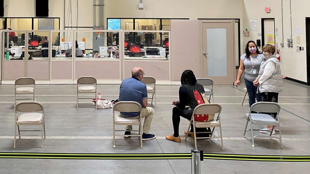 PHOTO: Observers watch the vote being counted at the Clark County Election Center in Las Vegas, Nov. 5, 2020.