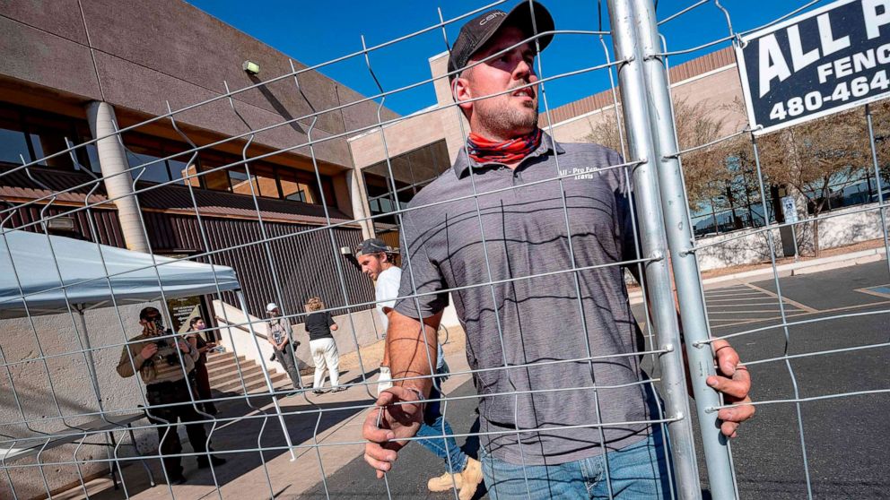 PHOTO: Security fences are put up around the Maricopa County Election Department in Phoenix, November 5, 2020.