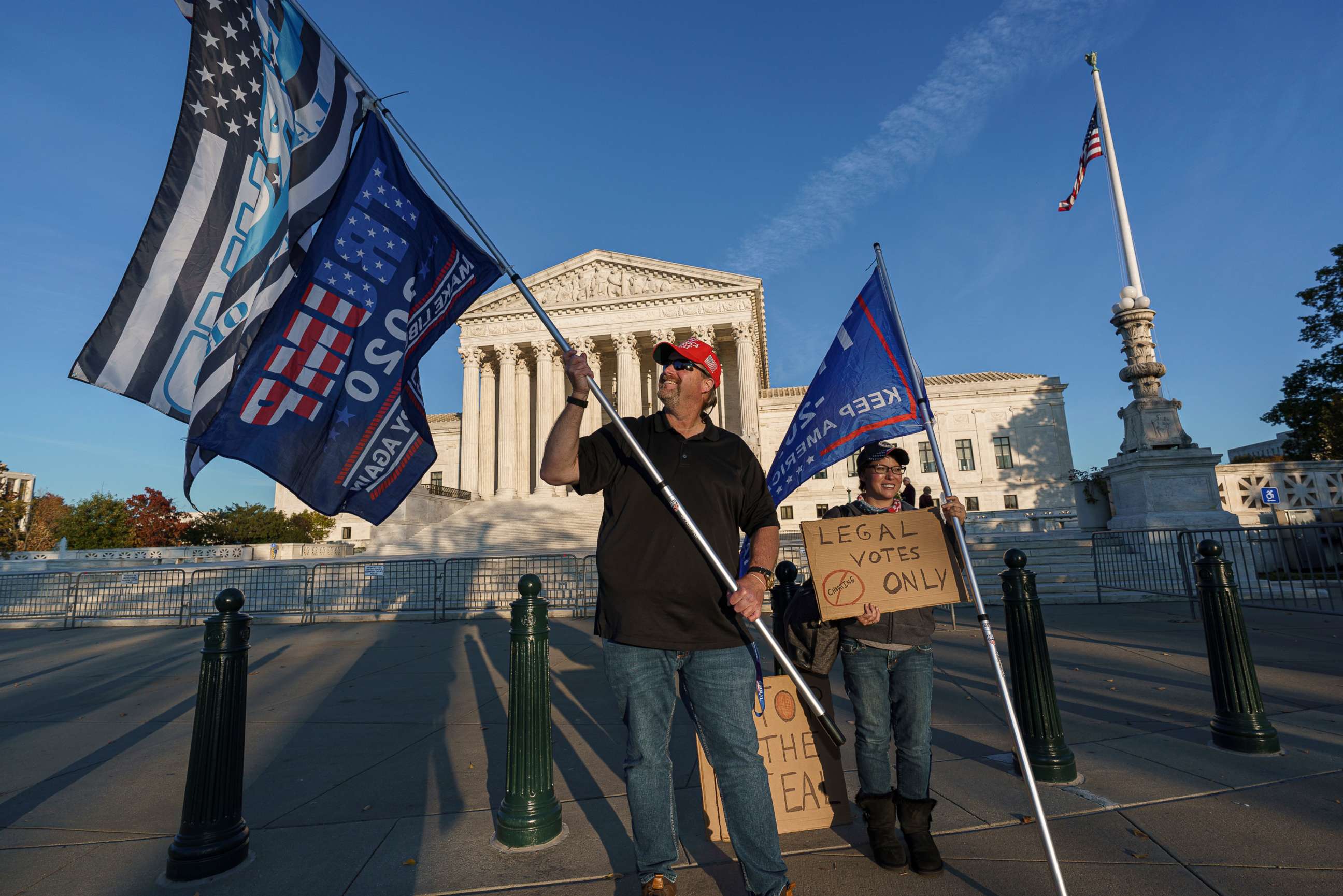 PHOTO: While waiting for a result in the election, Scott Knuth of Woodbridge, Va., and Christy Pheagin, of Washington, stand outside the Supreme Court in Washington, Nov. 6, 2020.