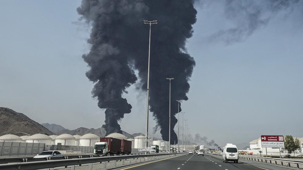 PHOTO: Smoke rises from the direction of an energy installation in the Gulf emirate of Fujairah on March 14, 2026.