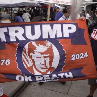 PHOTO: Supporters of Donald Trump faced one demonstrator who says the former president should be “put to death.”