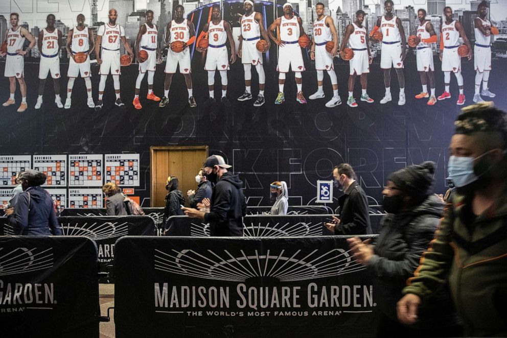 PHOTO: Voters line up to cast ballots outside Madison Square Garden, which is being used as a polling station, on the first day of early voting in New York City, Oct. 24, 2020.